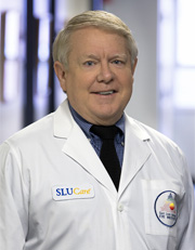 Headshot of Thomas Porter wearing white coat and smiling Headshot of Thomas Porter